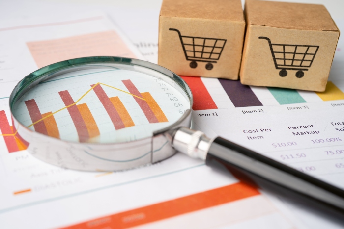 Magnifying glass on charts graphs paper. Financial development, Banking Account, Statistics, Investment Analytic research data economy, Stock exchange trading, Business office company meeting concept.